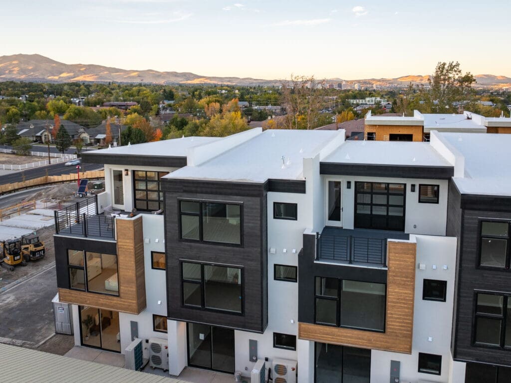 Wide drone shot of the full 18 On Lakeside development showcasing luxury condos Reno with modern design and a convenient central neighborhood setting.