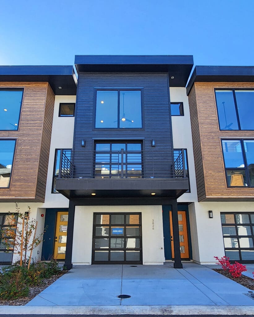 Interior of a new home Reno showing open living area, luxury kitchen, and bright natural light.